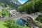 Man jumping into the river Versasca at Lavertezzo on Switzerland