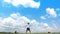 A man jumping slow motion and cloud sky background.
