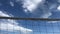 A man jumps on a block in beach volleyball.