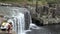 Man jumps off Charlies Rock waterfall in Kerikeri, New Zealand