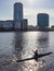 Man in a kayak on the background of the business center of Ekaterinburg Iset pond