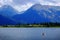 Man on Kayak on Lake Mountains Wilderness Paddling