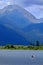 Man on Kayak on Lake Mountains Wilderness Paddling