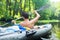 Man in kayak with oars. Kayaking on wild river