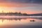 Man in a kayak on the river on the scenic sunset