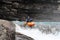 A man is kayaking in Norwegian river.