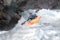 A man is kayaking in Norwegian river.