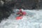 A man is kayaking in Norwegian river.