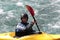 A man is kayaking in Norwegian river.