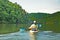 Man Kayaking on Quiet Lake