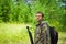 a man in khaki clothing in the open air, in the forest. Tourism and fishing