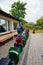 Man and kids at a train attraction