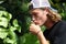 Man kissing Lizard beautiful multicolor animal in human hands, colorful reptile in Bali Idonesia