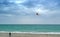 Man with a kite on the beach cost