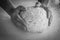 Man kneading a large dough for homemade bread in quarantine