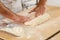 Man is kneading yeast dough