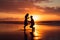 Man kneels on a beautiful beach at sunset, offering a heartfelt proposal to the woman he loves. Ai generated