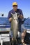Man with Large Fish - Lake Ontario King Salmon