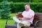 Man laughs out loud while reading a book