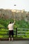 A man launching a drone near Pitigliano town, located atop a volcanic tufa ridge. Taking pictures frome the above. Digital