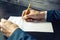 Man lawyer or official signs documents with a pen