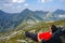 Man laying down the grass on the mountain