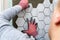 Man laying marble texture hexagon tiles on the wall