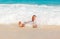 Man laying on sandy beautiful tropical beach