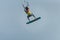 Man learning basic jumps kitesurfing, boy jumping at kiteboarding school. Kite surf lessons in the Canary islands, Fuerteventura