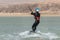 Man learning kitesurfing, man at kiteboarding school. Kite surf lessons in the Canary islands, Fuerteventura.  boy doing the water