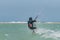 Man learning kitesurfing, men at kiteboarding school. Kite surf lessons in the Canary islands, Fuerteventura.  boy doing the water