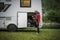 Man Leaving RV Park Campground and Checking His Motorhome Storage