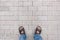 Man legs on gray brick blocks floor