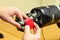 Man Lets Mechanical Robot Hand Holding a Red Cube in the Research Laboratory.