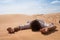 Man lie alone in the sunny desert. He is lost and out of breath. No water and energy.