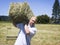 Man lifting hay bale