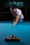 Man Lining To Hit Ball On Pool Table