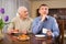 Man listening to reprimanding from aged father