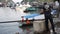 Man is loading ice blocks aboard a fishing boat at the port of Van Don, Vietnam