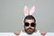 Man with long beard in bunny ears and glasses