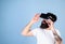Man with long beard in VR goggles amused with new multidimensional experience. Hipster with trendy beard testing virtual