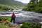 Man looking at Aasleagh Falls