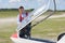 Man looking at cab sailplane