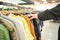 Man looking for clothing at marketshop. Man at shopping - new fashion collection at fashionable clothes store