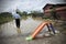 Man looking the consequences of flooding.