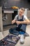 Man looking at detail sitting on floor