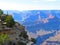 A man looking down the Grand Canyon