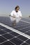 Man looking down on solar power panels