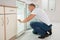 Man Looking Into An Empty Refrigerator