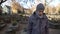 Man looking at gravestone at cemetery, praying and sharing news with deceased